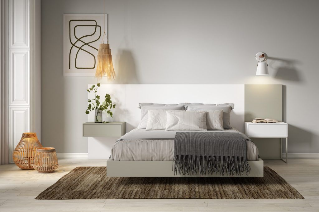 Dormitorio con cabezal combinado Dormitorio con cabezal y bañera y mesitas asimétricas, combinando color blanco y verdoso.